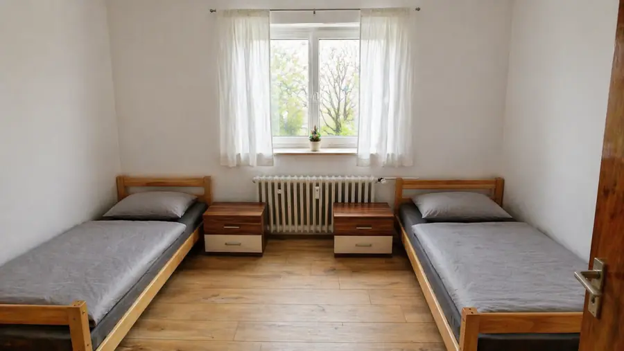 Schlafzimmer mit zwei Einzelbetten in einer Monteurwohnung in Nordhorn
