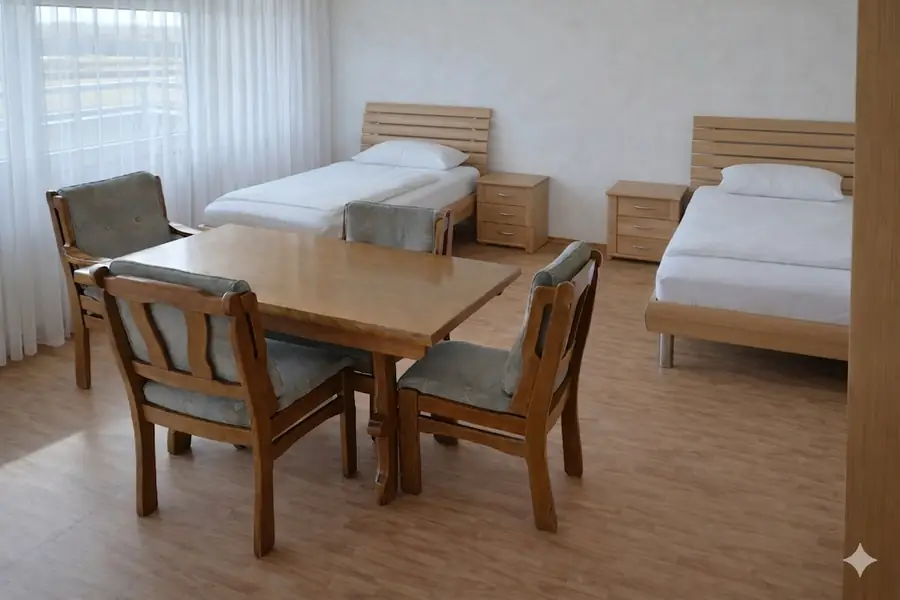 Monteurwohnung in Nordhorn mit Einzelbetten und Tisch für Firmen und Monteurteams